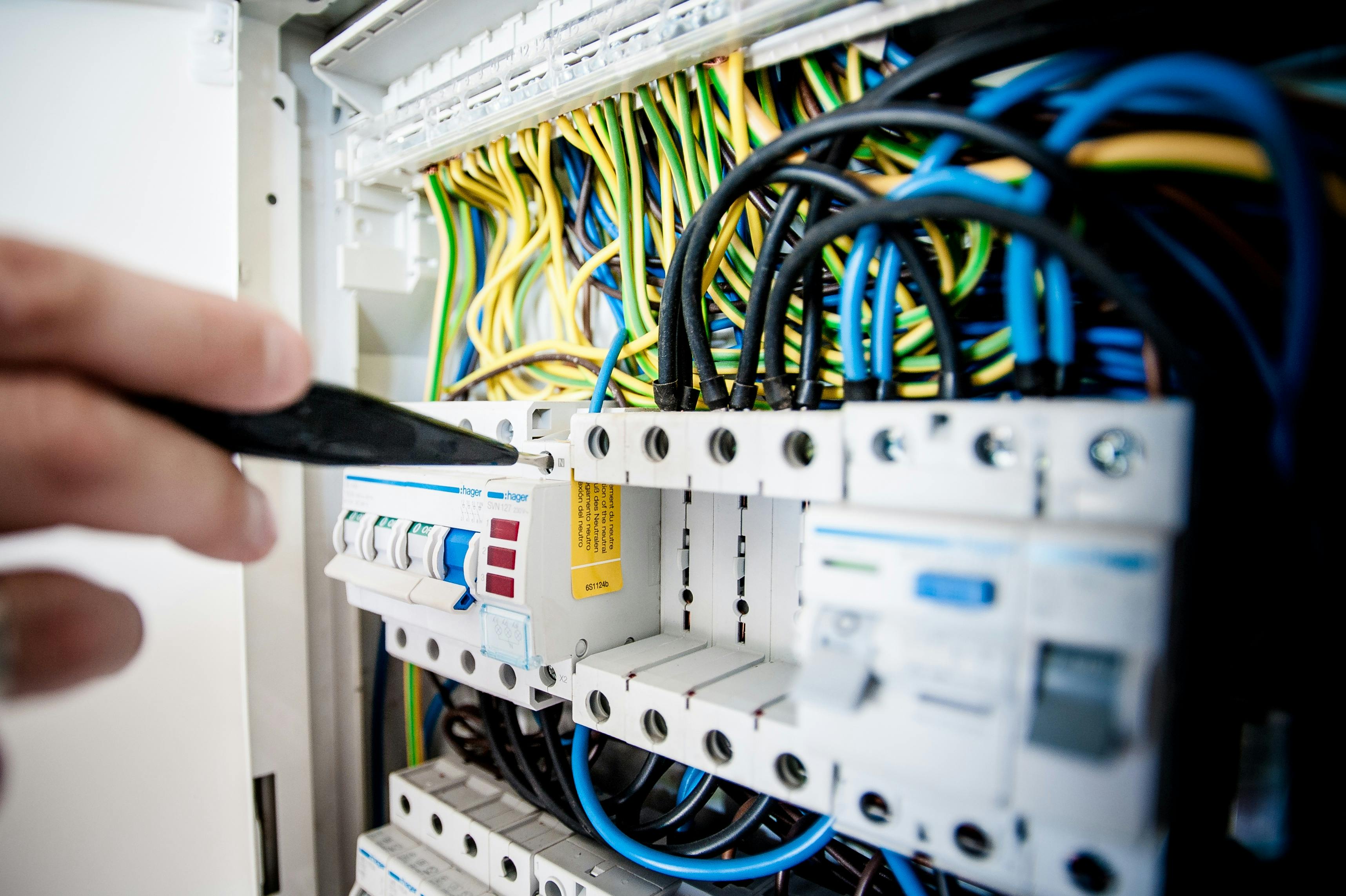 https://www.pexels.com/photo/electrician-fixing-an-opened-switchboard-257736/